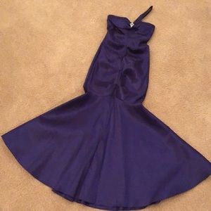 Purple floor length formal with rhinestone brooch